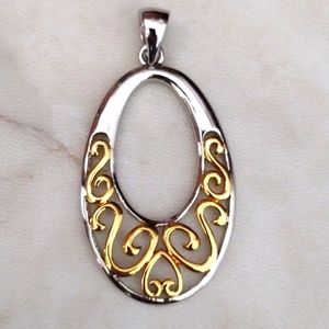 LS silver and gold pendant.